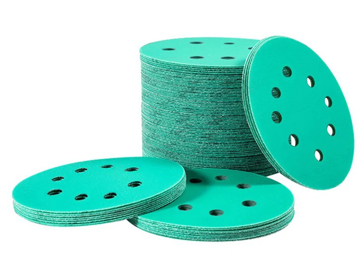 Adhesive sanding discs